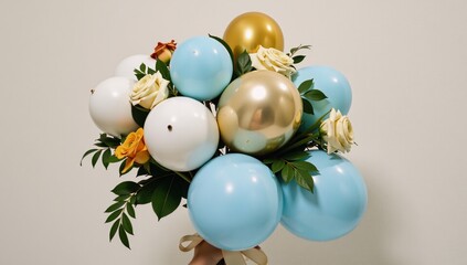 Gold and light blue balloon bouquet with delicate roses in an ornate floral arrangement perfect for birthday invitations parties events and weddings