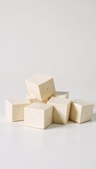 Fototapeta premium Ok White background features a pile of tofu cubes