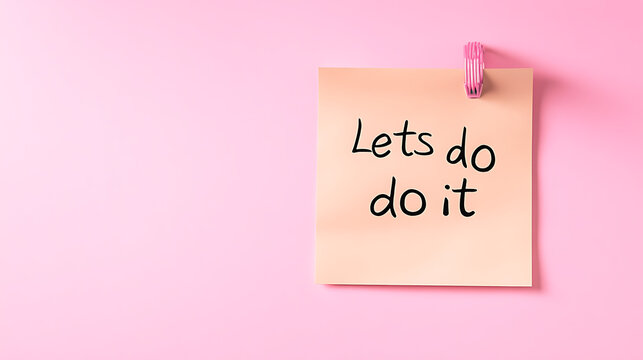 Inspirational message on a pink background, encouraging action. The note reads "Lets do it", urging viewers to take initiative and get things done.