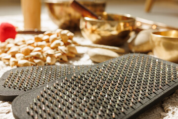 Acupressure Mats and Singing Bowls for Foot Massage and Wellness Rituals Close Up