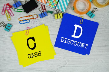 CD - Cash Discount text on stick note with stationery on concrete background