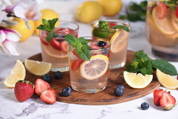 Lemonade with strawberries, blueberries and mint. Perfect for a hot summer day