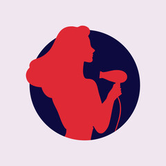 Woman holding a hair dryer while preparing for a stylish look in a modern salon setting