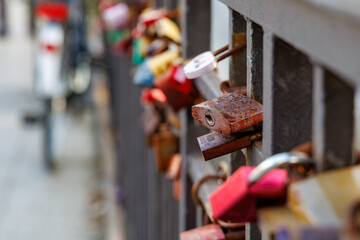 One of many padlocks at a bridge railing, symbolizing eternal love (locked and key thrown into the river)