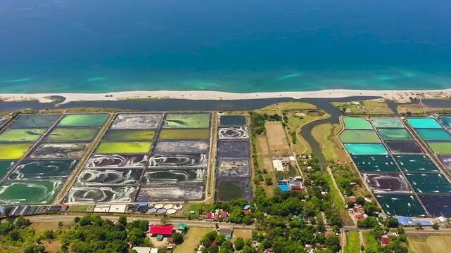 Pump ponds at a shrimp farm in the Philippines.Prawn farm with aerator pump.
