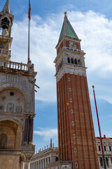 A photo of a tall clock tower with a clock on top
