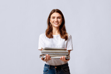 Waste Sorting. Portrait Of Beautiful Young Woman Holding Stack Of Old Magazines In Hands,...