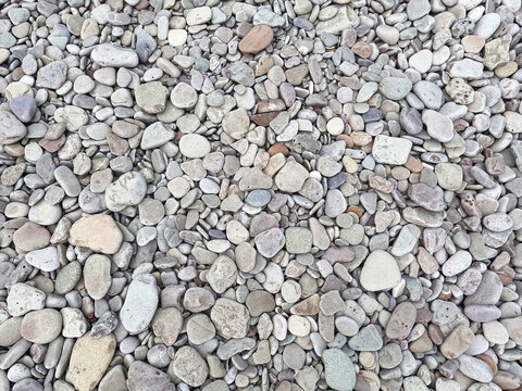 Sea pebble texture, natural grey stone background