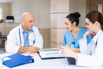 Team of doctor and nurse is discussing and brainstorming on patient medical record after diagnosis...