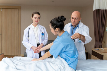 Caucasian senior doctor have morning round ward to check up on patient in the hospital for healthcare and medical
