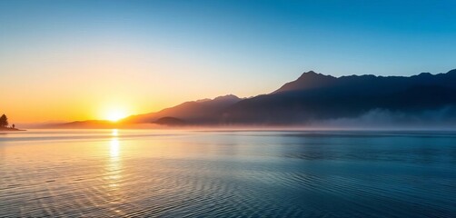 Dreamy sunrise over a tranquil lake, misty mountains in background,  vision,  direction
