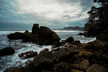 Fototapeta premium coral reefs on the coast with a cloudy blue sky, beach 2