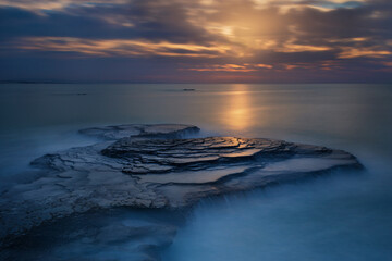 Sun streak on the sea at sunrise