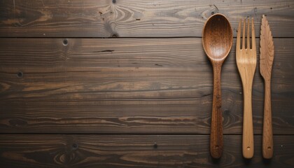 Wooden Cutlery Set on Rustic Wooden Table Surface in Warm Lighting.