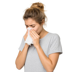 female with cold symptoms sneezing into paper tissue
