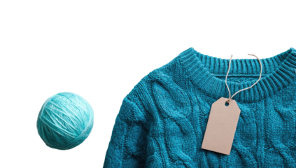 Teal sweater and yarn ball, overhead view