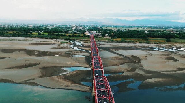 4K Aerial View Of Cagayan River Crossing, Buntun Bridge Connecting Tuguegarao City and Solana
a unique aerial perspective of the bridge as it spans the historic Cagayan River.