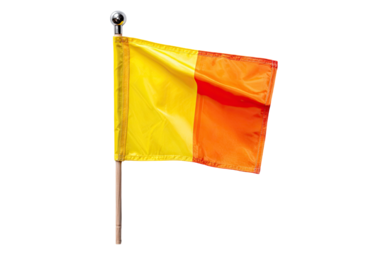 A yellow and orange referee flag, billowing slightly, on a light-brown wooden pole, set against a black background