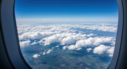 High Altitude Vista: A serene view from an airplane window over fluffy clouds and a patchwork of green land below.