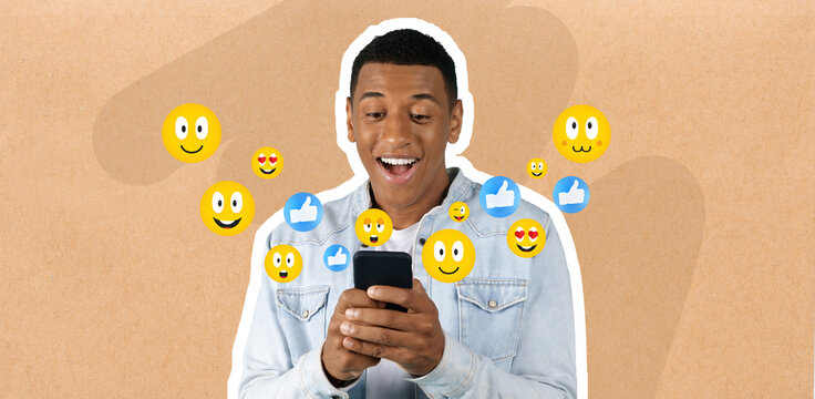A young man smiles as he chats on his smartphone, clearly engaged with the conversation. Colorful emojis surround him, highlighting his excitement and enjoyment of social media interactions.