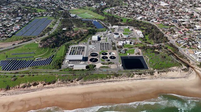 SA Water Christies Beach Wastewater Treatment Plant, O'Sullivan Beach, South Australia: 4K Aerial Drone Footage of Coastal Facility, Clarifier Tanks, Infrastructure, Solar Panels, and Nearby Beach