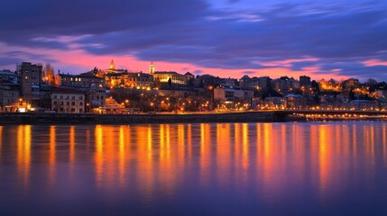 Fototapeta premium Serene Twilight Over City Skyline and River Reflection at Dusk