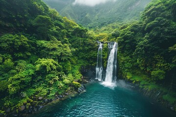 Majestic Waterfall Surrounded by Lush Greenery in Tropical Forest