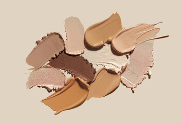 Set of different textures of cosmetic foundation, concealer, highlighter, soft powder, bronzer, on...
