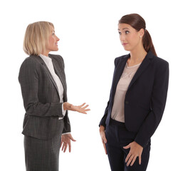 Two businesswomen having a discussion, isolated on white background


