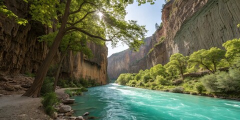 Turquoise river flows through majestic sunlit canyon