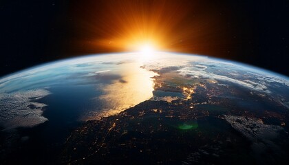 Obraz premium cinematic shot of the earth from space half in shadow with the sun rising on one side