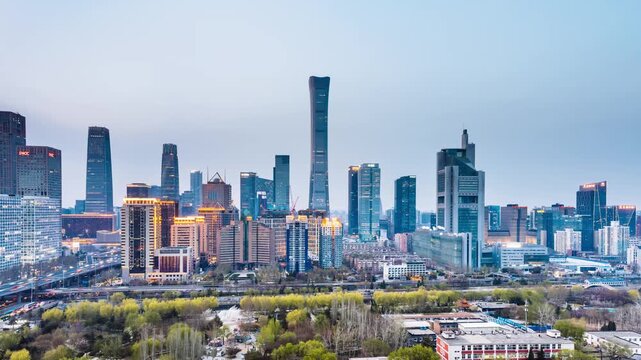 High angle night view Day-to-Night timelapse of International Trade Center CBD complex and overpass in Beijing, China