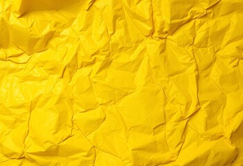 Deep creases and folds texture a vibrant yellow bag surface, old, background