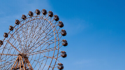 Vintage Ferris Wheel Against Clear Blue Sky