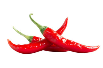 Three ripe red chili peppers isolated on black background