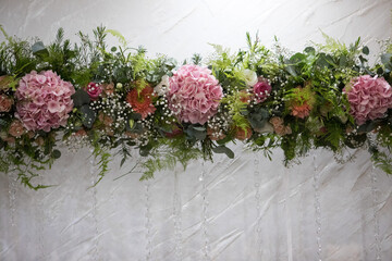 Beautiful floral arrangement featuring hydrangeas and greenery enhances the ambiance of a...