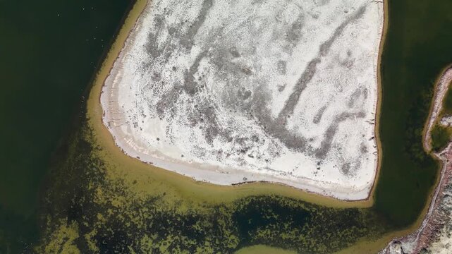 Top-down aerial view of the canal in Aralsk. The Kokaral Canal, built in 2005, has allowed the Northern Aral Sea to be partially restored and the salinity of the water to be reduced.