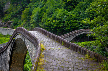 Historical bridges and rivers firtina rivers and cifte bridge Turkey. Old and historic bridges green nature, on river Artvin turkey. ''Cifte Kopru''double bridge area.