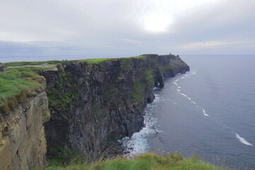Majestic Cliffs of Moher in Ireland – Towering Sea Cliffs Against the Atlantic Ocean, Lush Green...