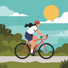 A silhouette of a woman bicyclist riding her mountain bike on the beach during a summer sunset