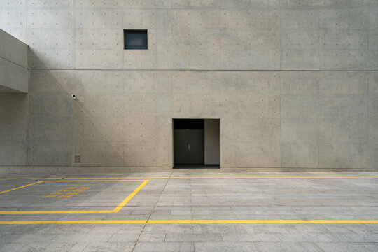 empty ground with modern building made with concrete - Powered by Adobe