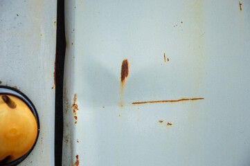 Close-up of a rusty metal surface displaying corrosion and deterioration, emphasizing wear and age...