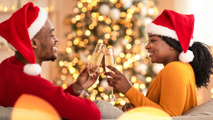 Romantic date in New Year and self-isolation in covid-19. Young smiling african american male and...