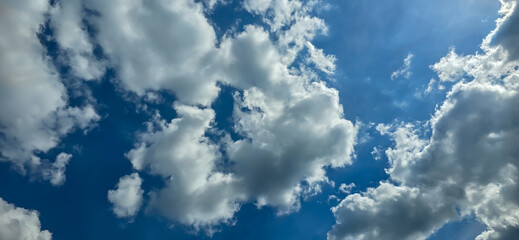 Blue sky with white clouds. The background is a clear blue sky without any cumulus clouds.