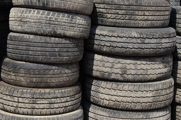 A Large Stack of Used Car Tires