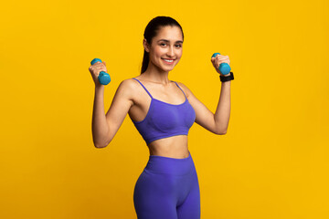 Biceps Exercises, Arms Workout. Portrait Of Happy Young Sportswoman Doing Training With Two Blue...