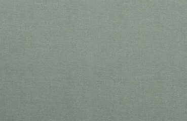 Fototapeta premium Soft gray floor with brown wall and rectangular green object. Harmonious, organized space with flat, seamless design. Gray, green, brown colors. Linen texture fabric background. Close-up view.