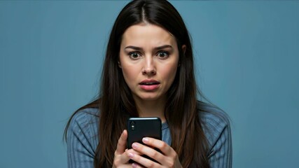 Woman with shocked expression holding smartphone looking at screen in surprise. Social media reaction concept for digital communication and technology addiction awareness campaigns - Powered by Adobe