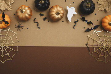 Happy halloween background with party decorations from pumpkins, bats, spiderweb, ghosts top view....