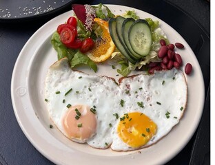 Salad with fried egg cheese